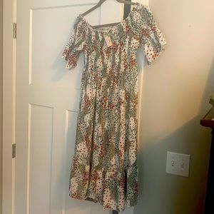 Smocked knee length baby doll dress.